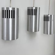 Set of 3 vintage brushed metal pendants, France, 1970.