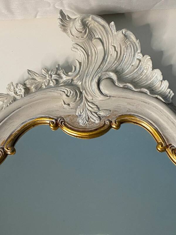 Magnificent patinated and gilded baroque style mirror