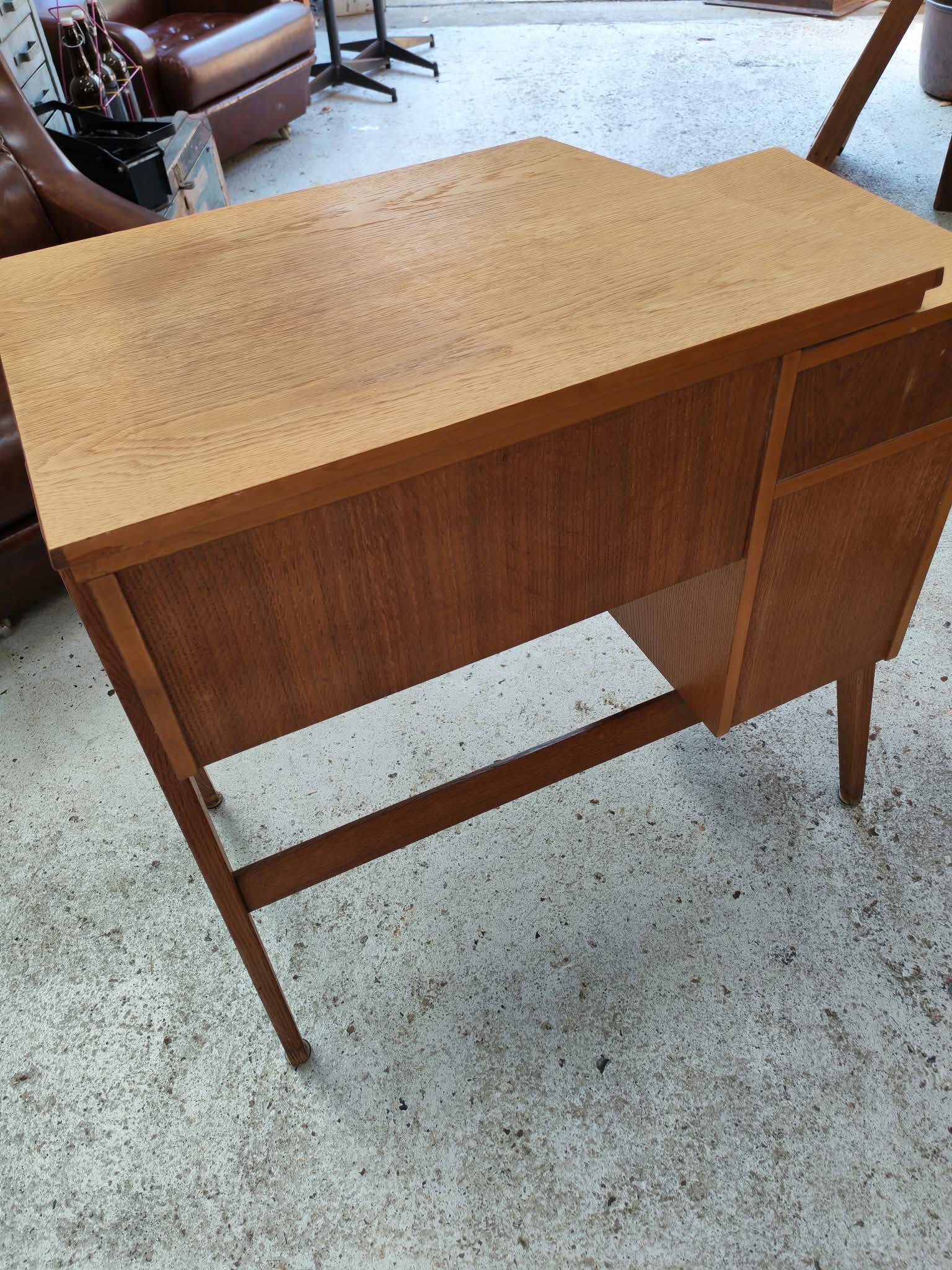 Vintage 1950s side desk with tapered legs.
