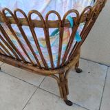 Vintage rattan bed on wheels cradle