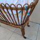 Vintage rattan bed on wheels cradle