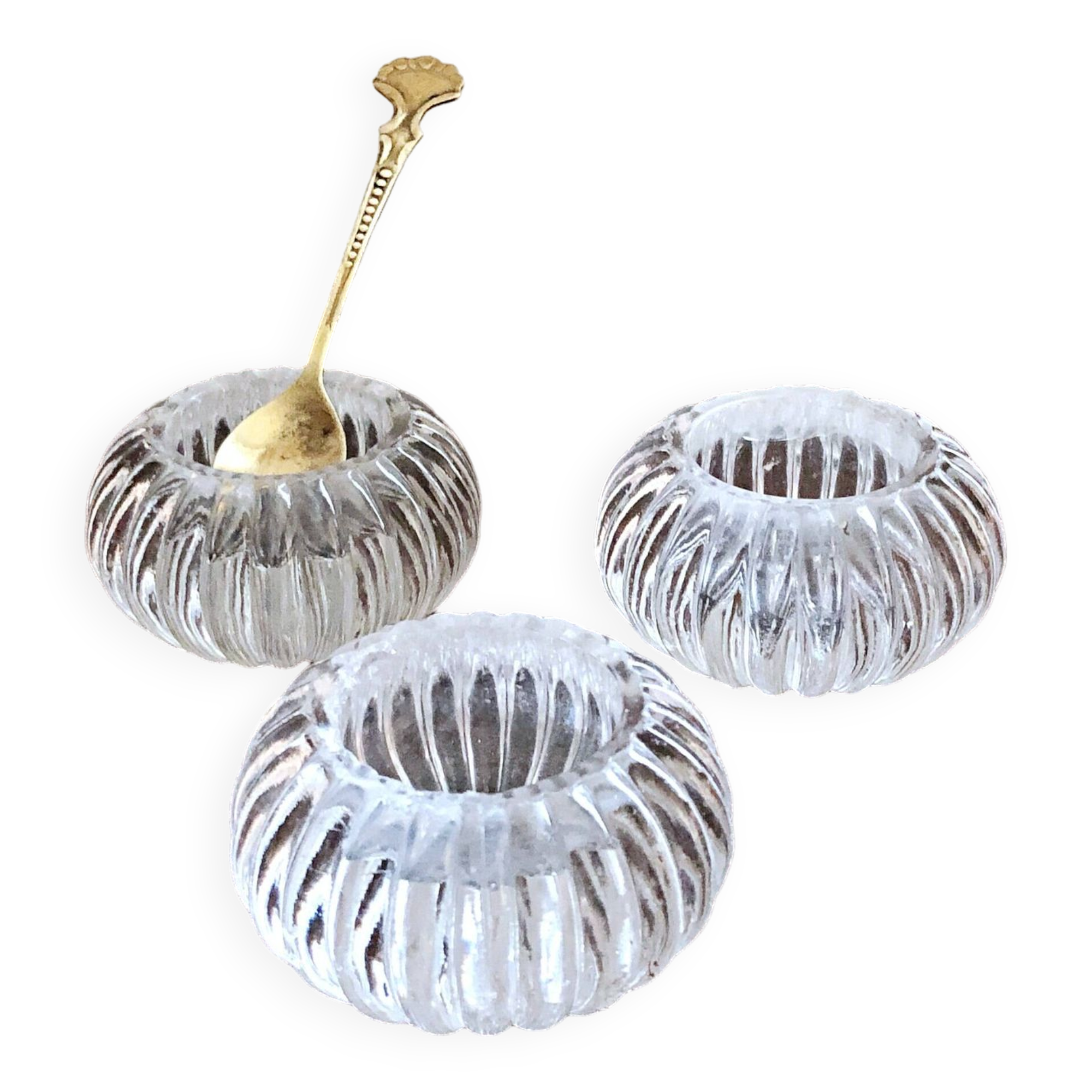 Trio of salt shakers, pepper shakers, molded glass salt shakers