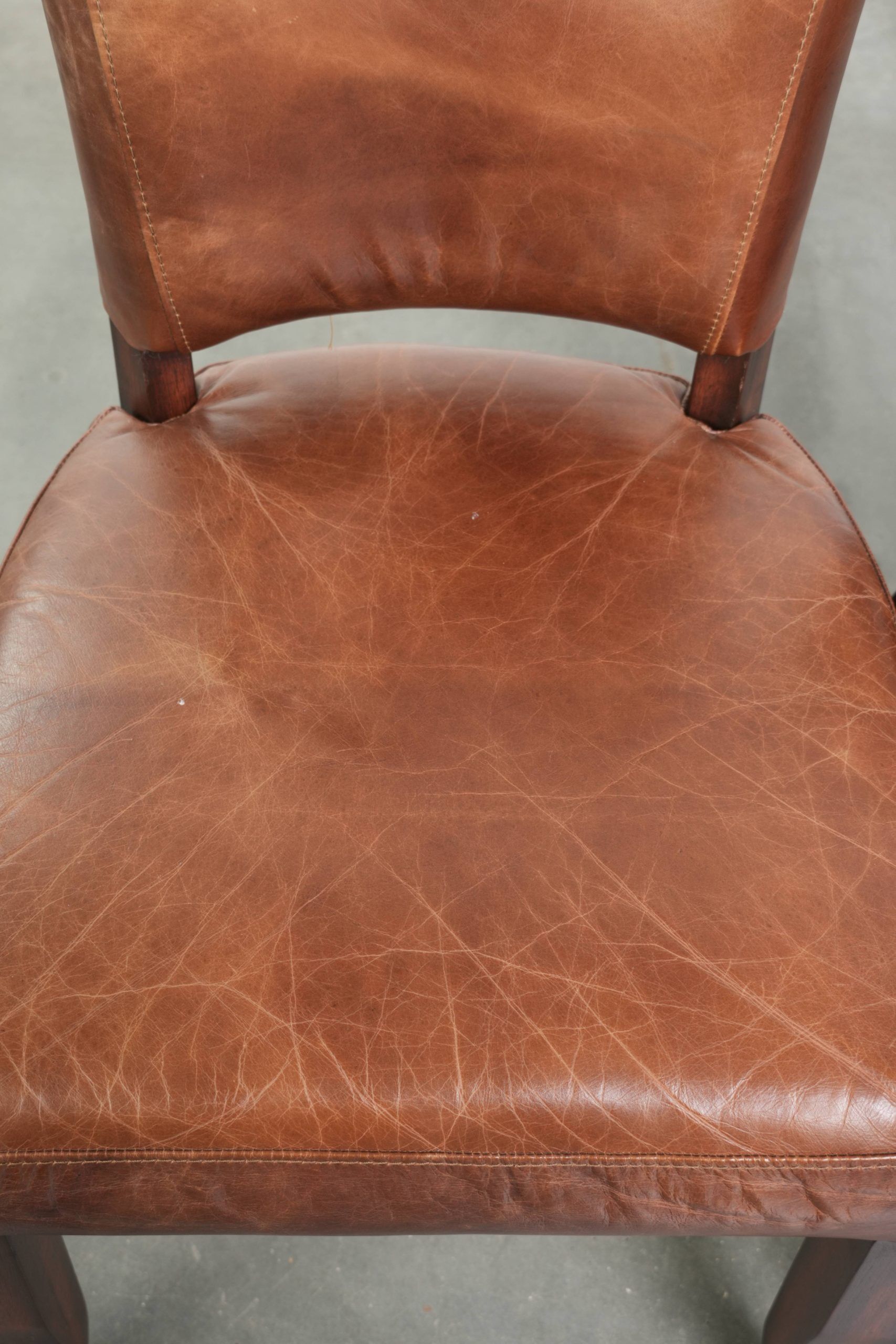 Set of 4 cognac-coloured cowleather dining chairs with decorative nails
