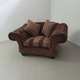 Large weighty love seat with the original matching cushions. Marked "Handmade in Holland"