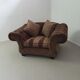 Large weighty love seat with the original matching cushions. Marked "Handmade in Holland"
