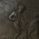 EIGHTEENTH CENTURY CAST IRON FIREPLACE PLATE REPRESENTING A WOMAN AND A WOLF