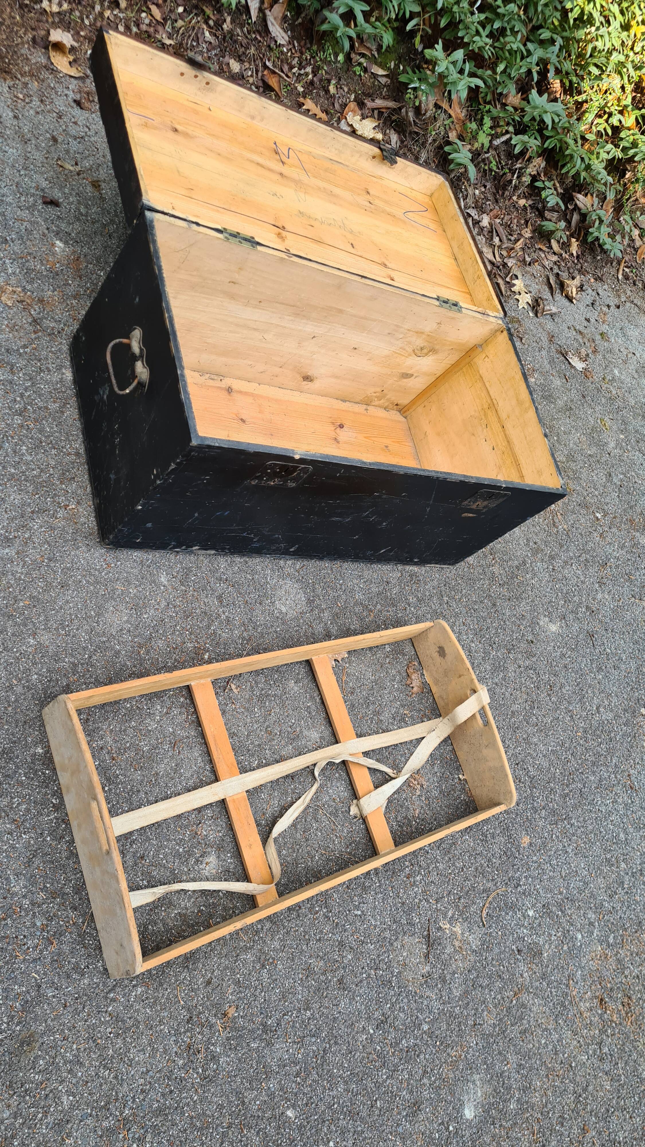 Old wooden trunk with interior compartments