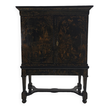 A rare early 18th-century Dutch japanned chinoiserie cabinet, circa 1700
