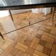 Black marble coffee table with brass legs.