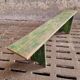 Old wooden bench side table grass green