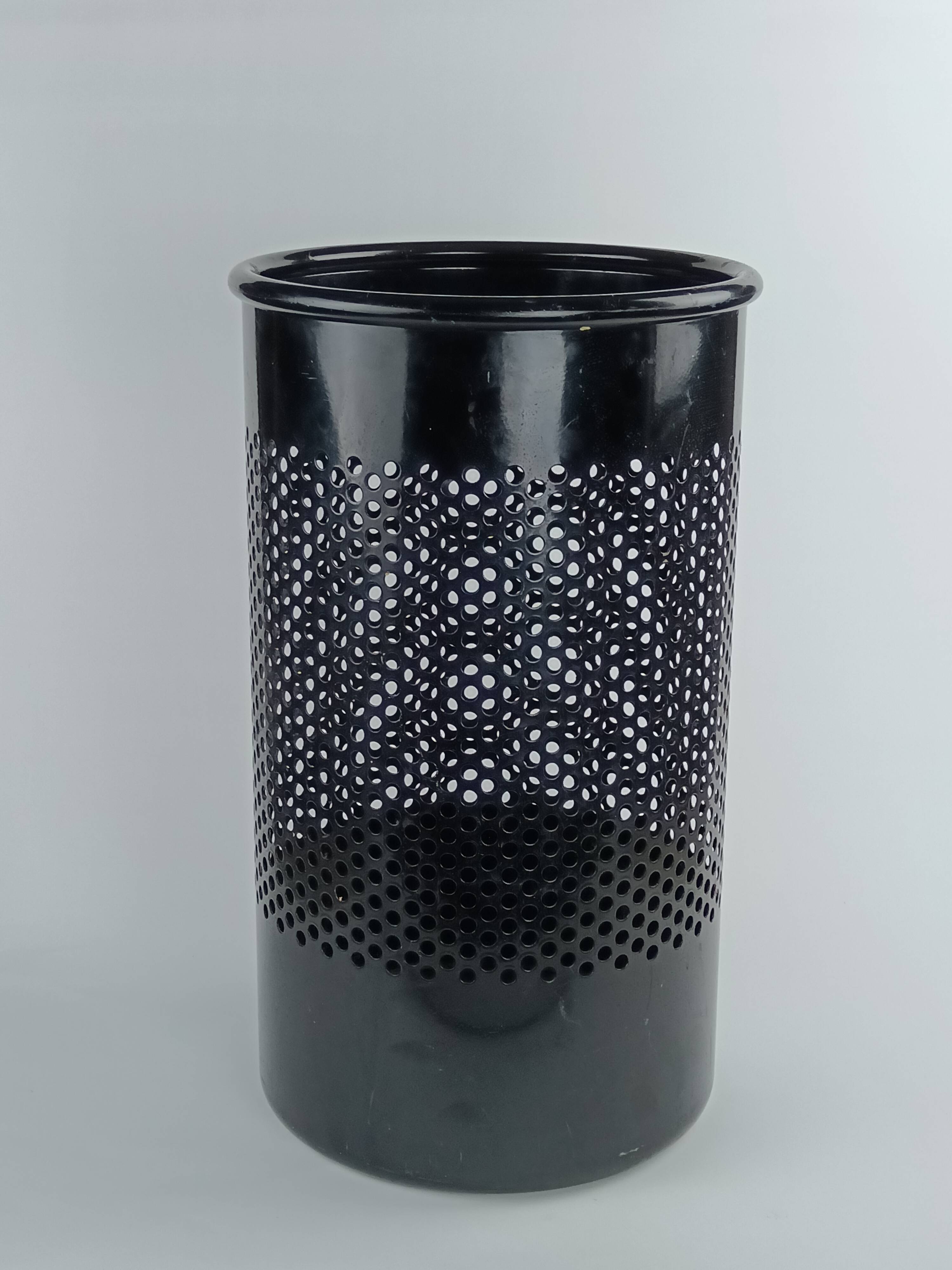 Perforated metal wastebasket