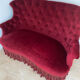 Small old Napoleon III toad sofa in red velvet