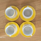 4 yellow and white cups and saucers