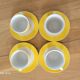 4 tasses et sous-tasses jaunes et blanches