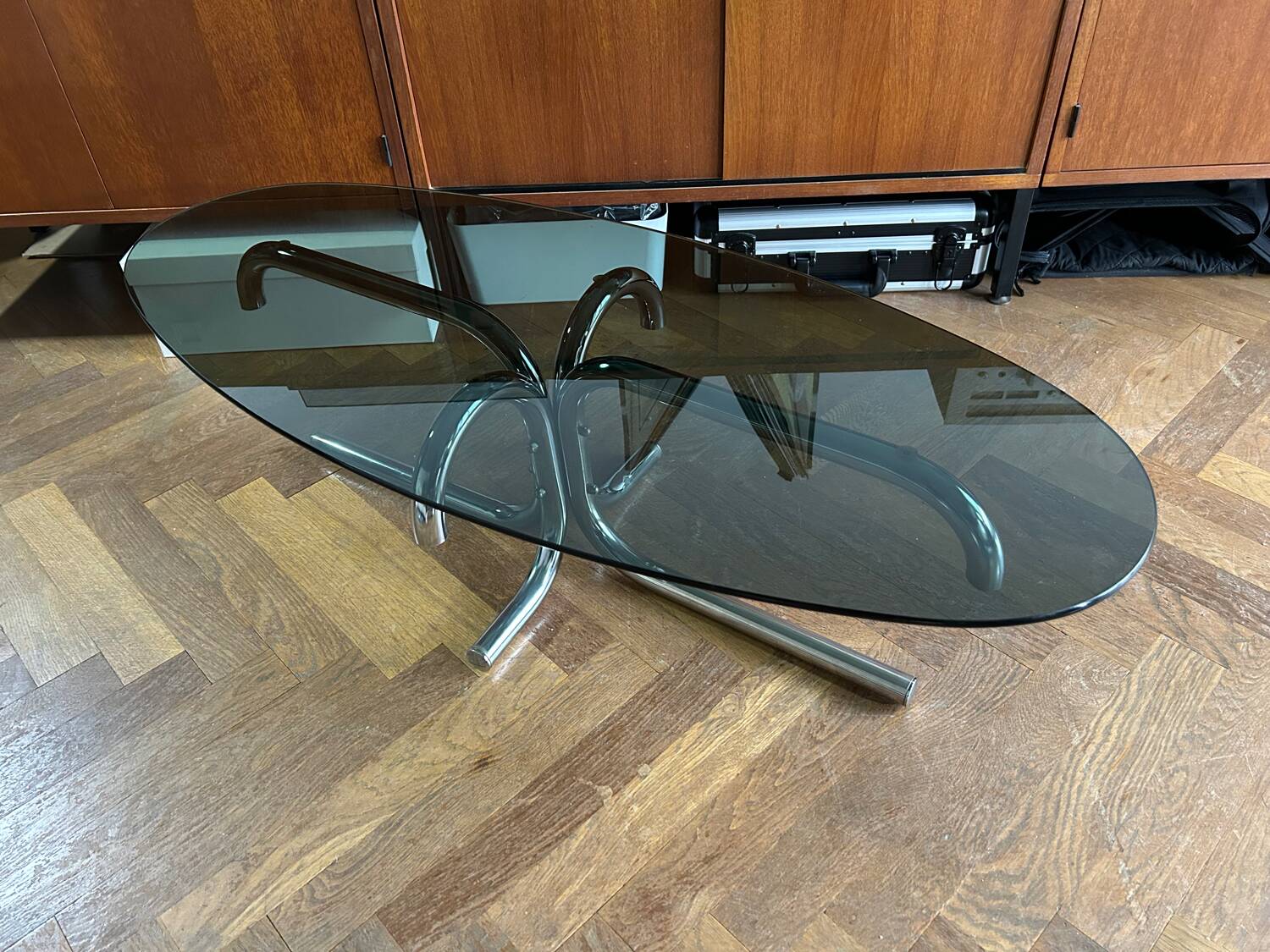 70s design oval coffee table in smoked black glass with chrome legs.