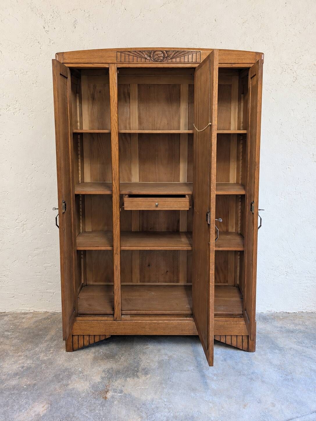 Art Deco oak wardrobe with three doors and bevelled mirror.