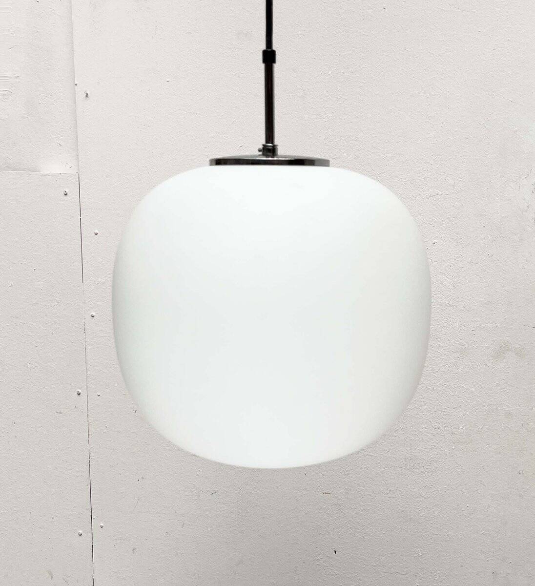 Minimalist suspended glass ball lamp from the vintage German space age by Glashütte Limburg, 1970s.