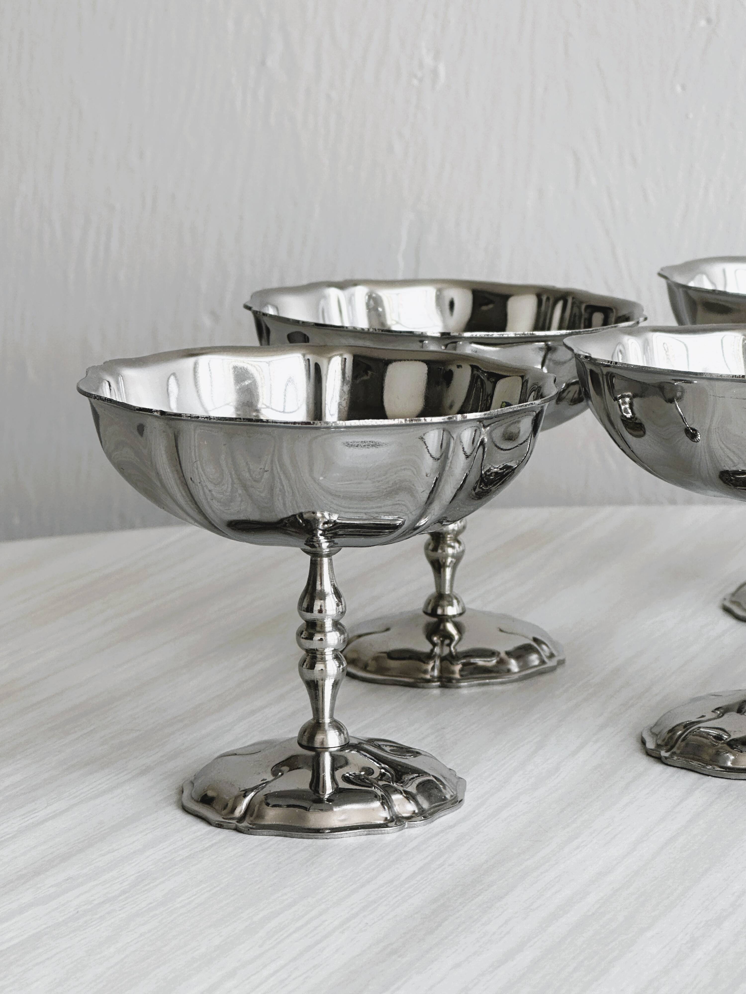 6 silver stainless steel bowls.