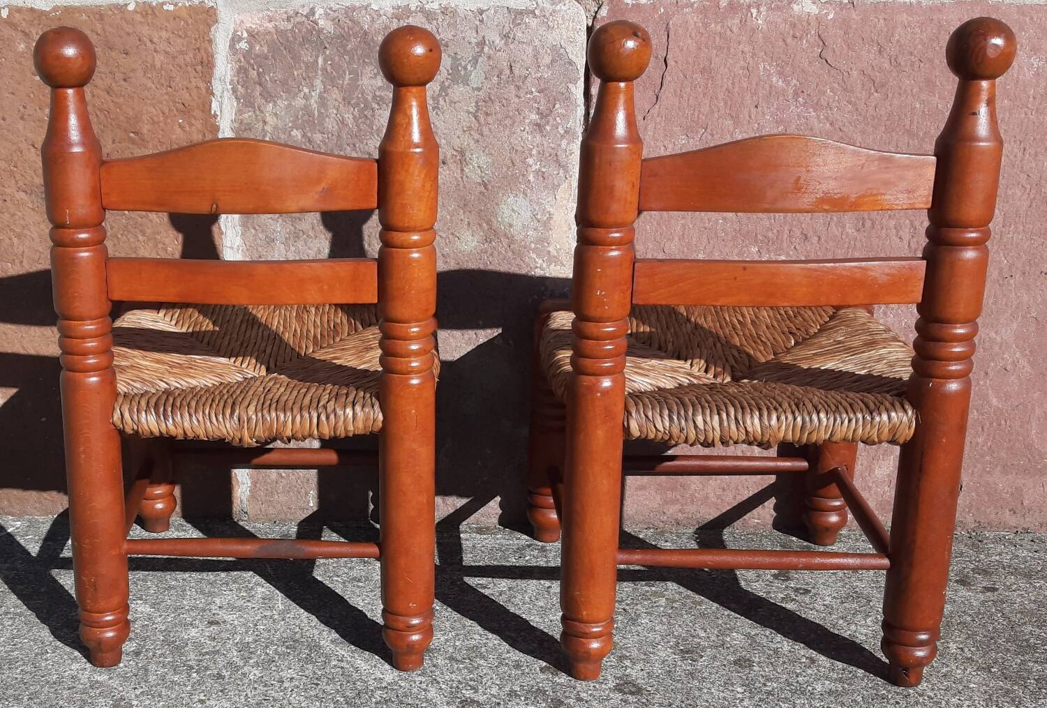 Pair of low armchairs by the fireplace. (Straw seat)