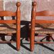 Pair of low armchairs by the fireplace. (Straw seat)