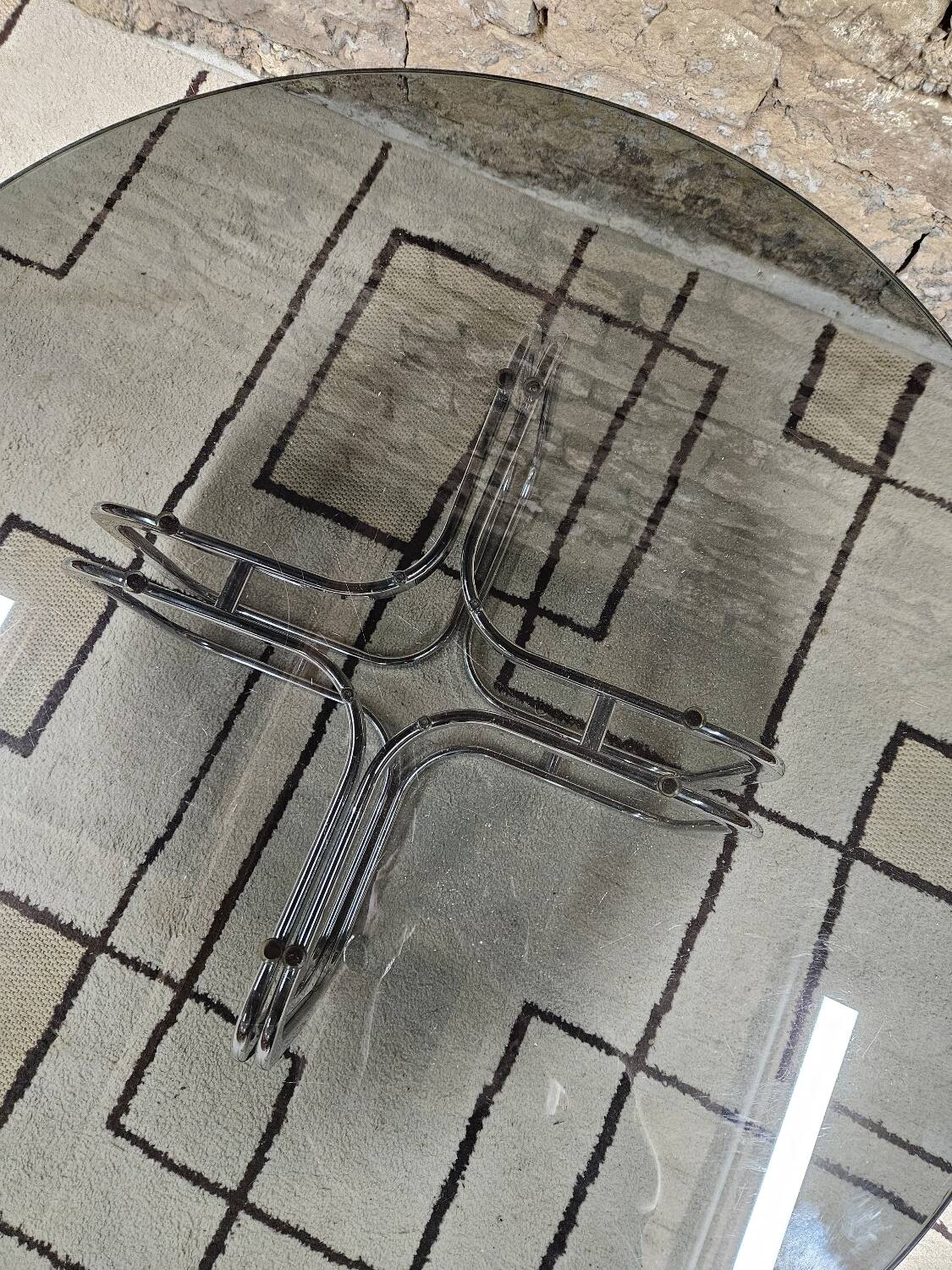 Round chrome coffee table with smoked glass