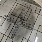 Round chrome coffee table with smoked glass