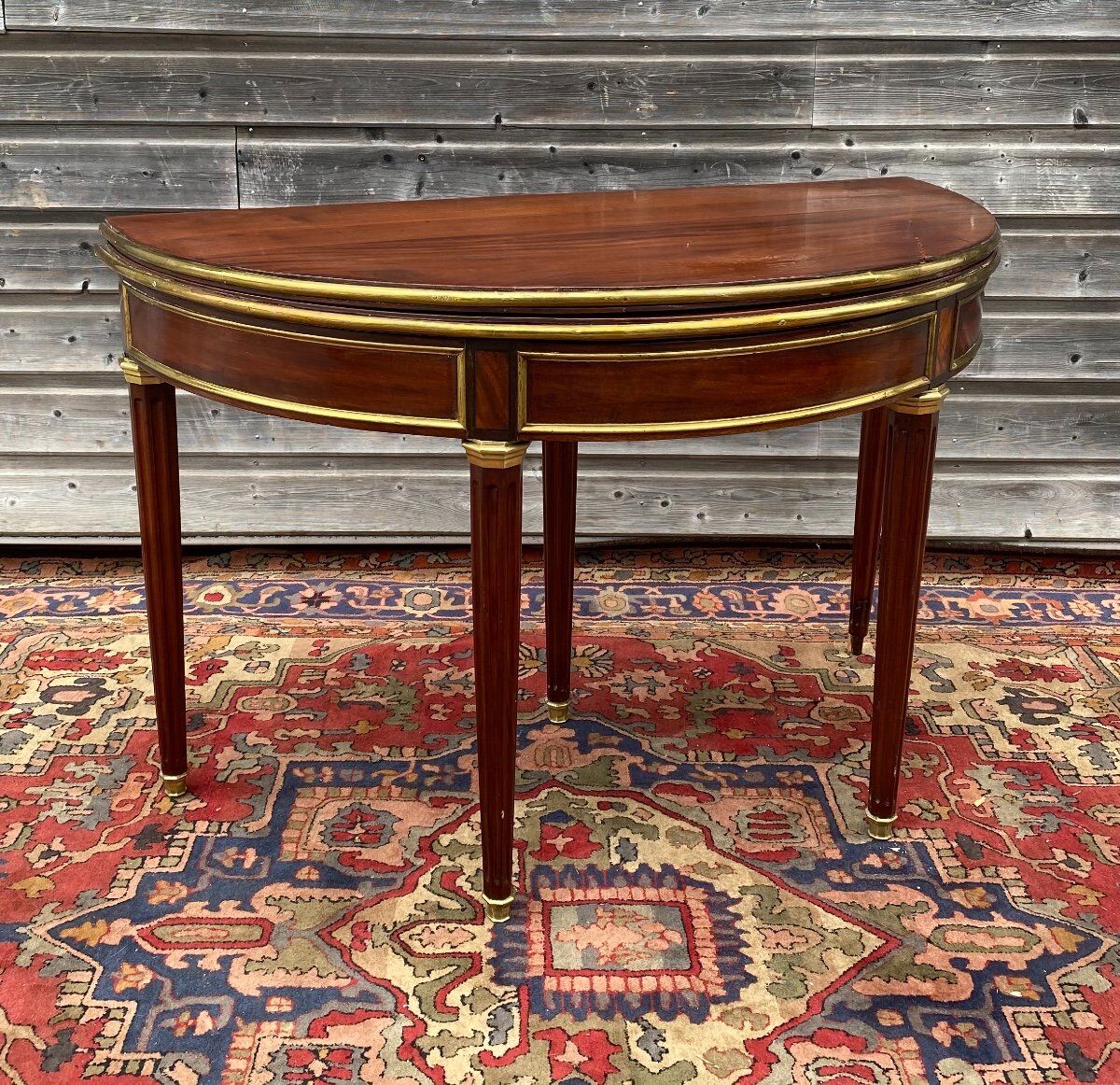 Half moon table in mahogany era Louis XVI XVIII th century