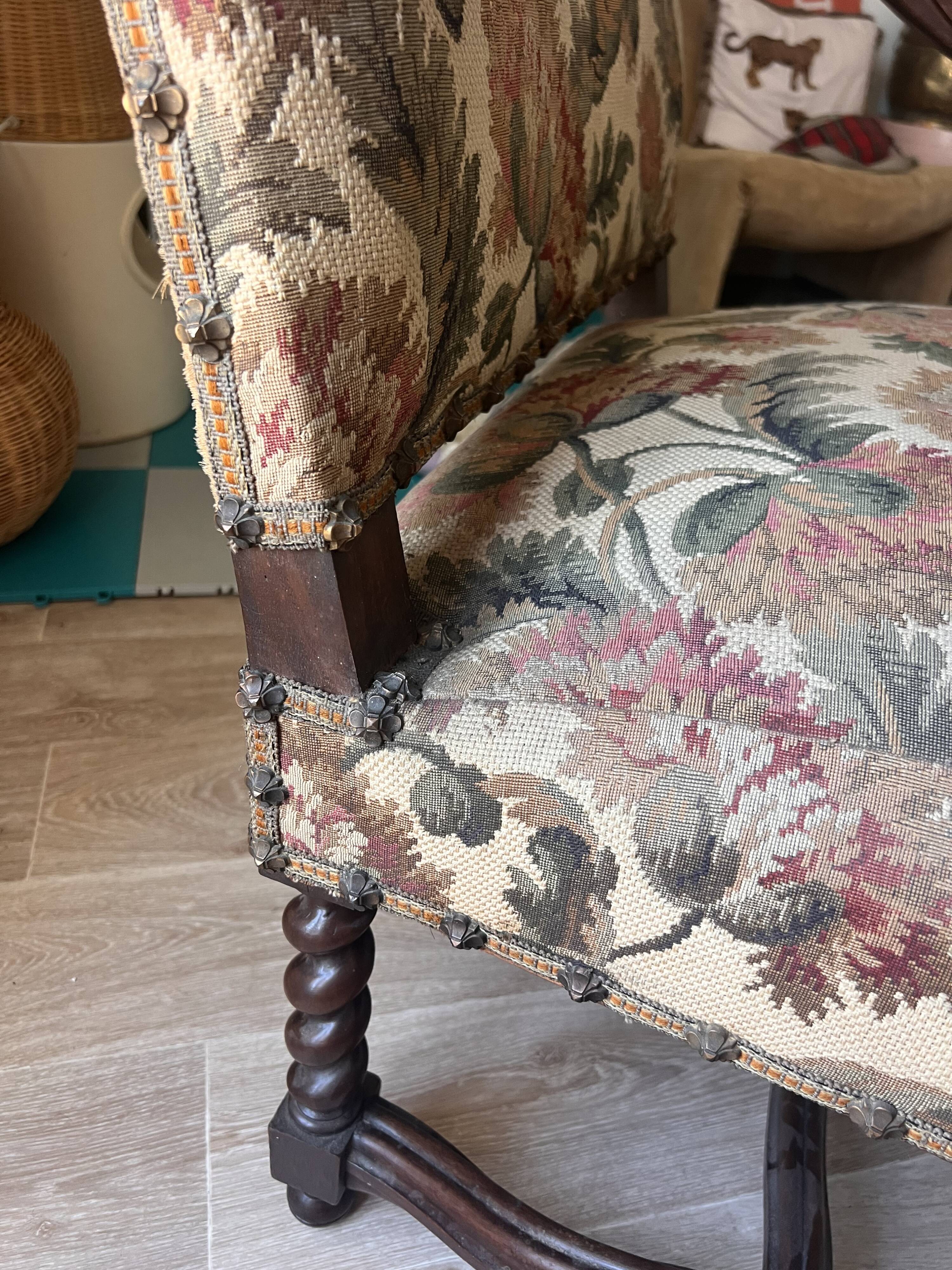 Antique armchair in Henri II style with masks