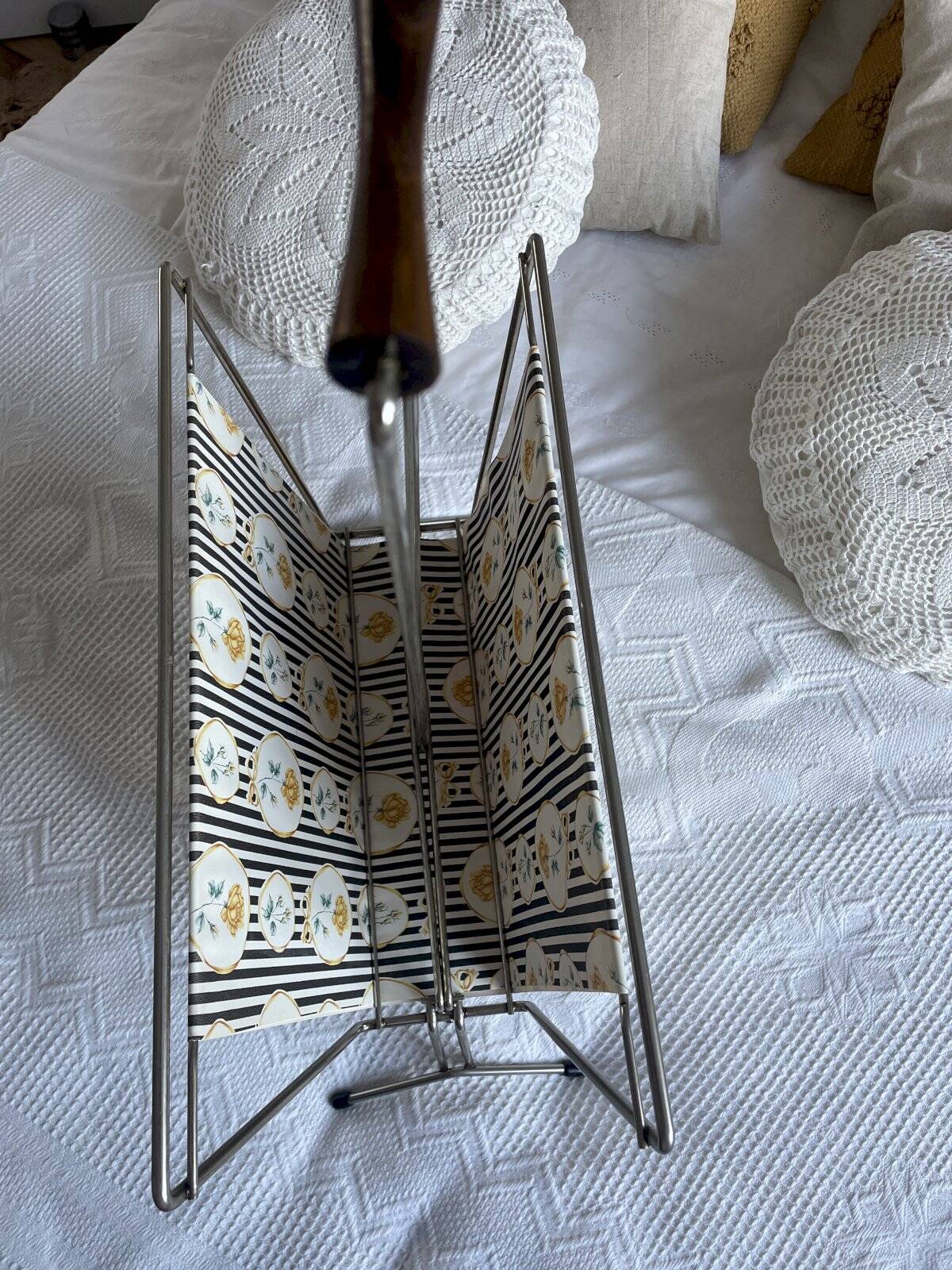 Vintage metal and plastic-coated fabric magazine rack