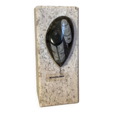 An asymmetrical travertine and fossil bookend.