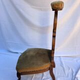 Low armchair in carved wood