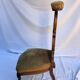 Fauteuil bas en bois sculpté