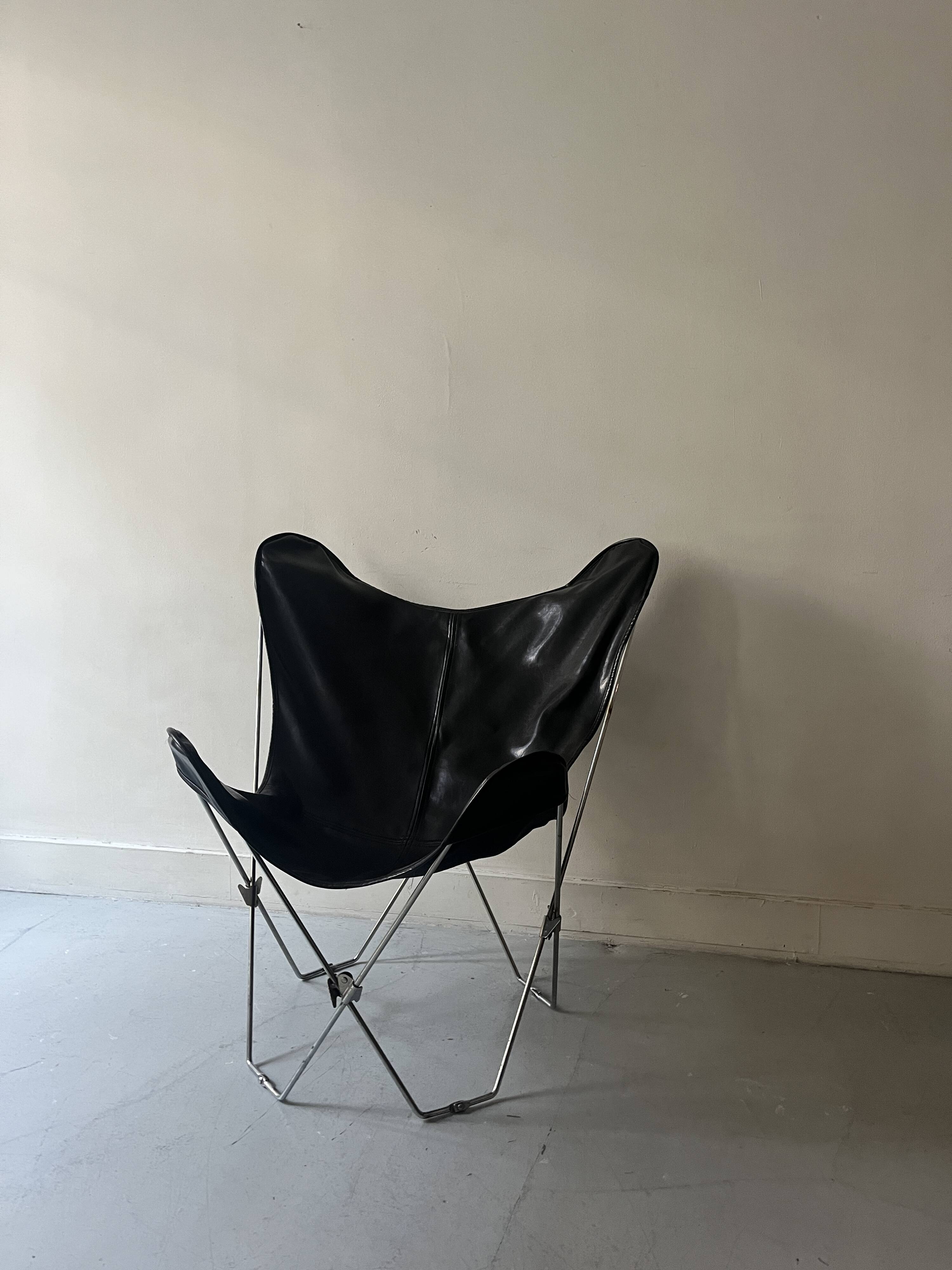 designer butterfly armchair in chrome and black leather