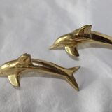 Family of dolphins in vintage brass