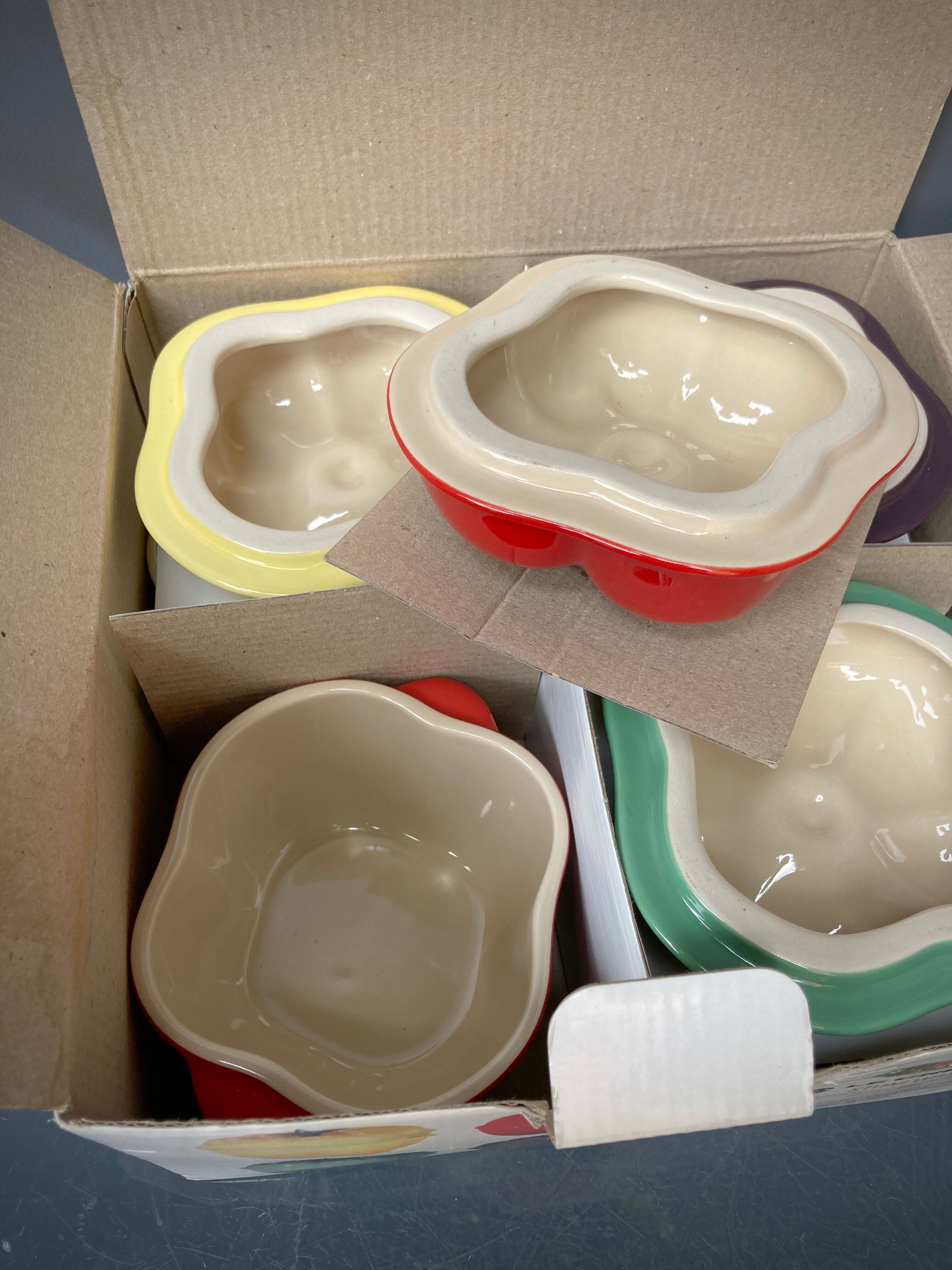 Four Le Creuset ceramic casseroles