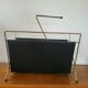 Vintage metal magazine rack in gold and black vinyl Newspaper holder