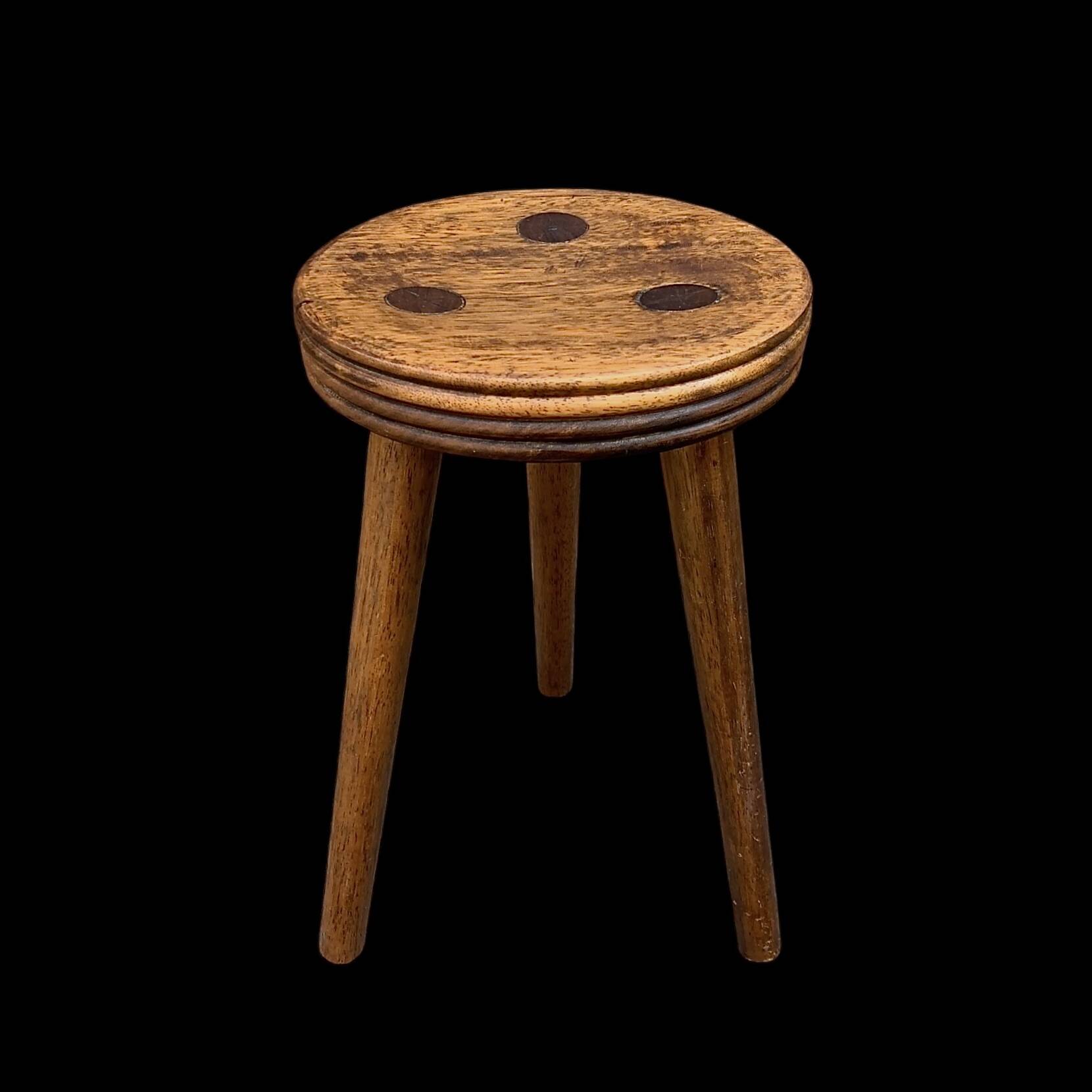 Old small wooden tripod stool