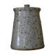 Pot with speckled sandstone lid