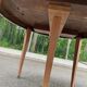 Renovated round extendable dining table made of solid mahogany from the 19th century.