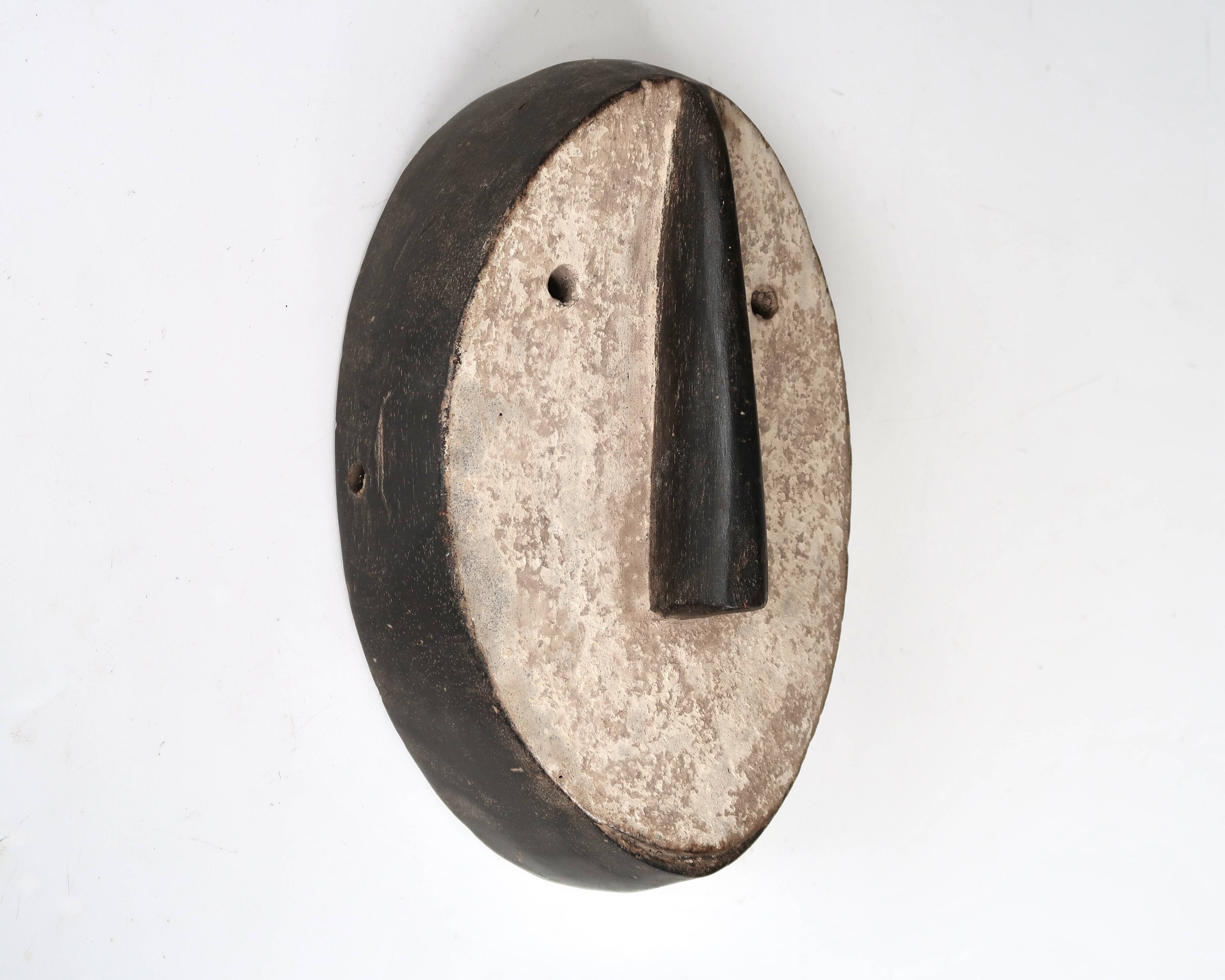 Minimalist wooden African wall mask, vintage Africa