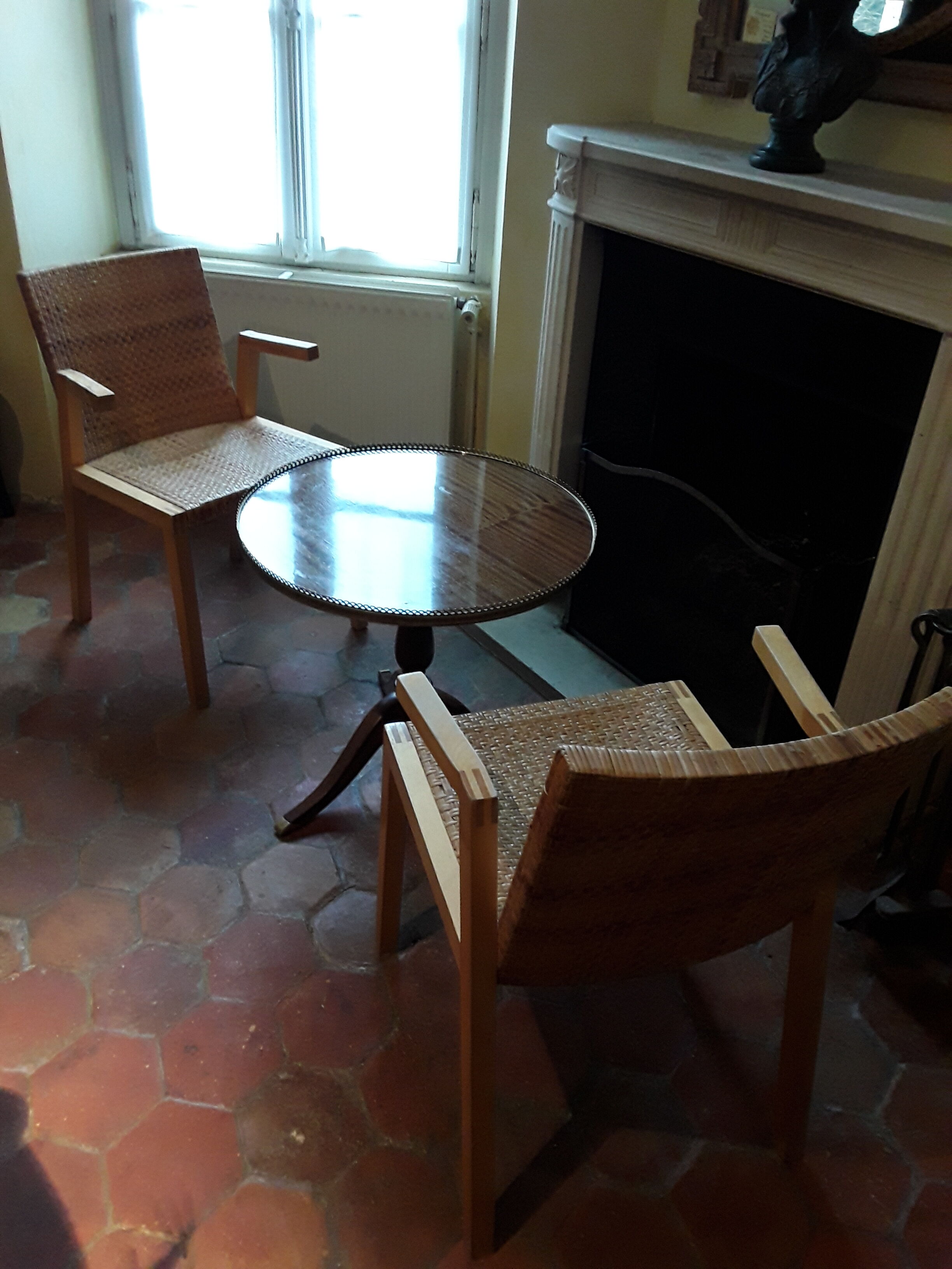 Two vintage braided straw armchairs