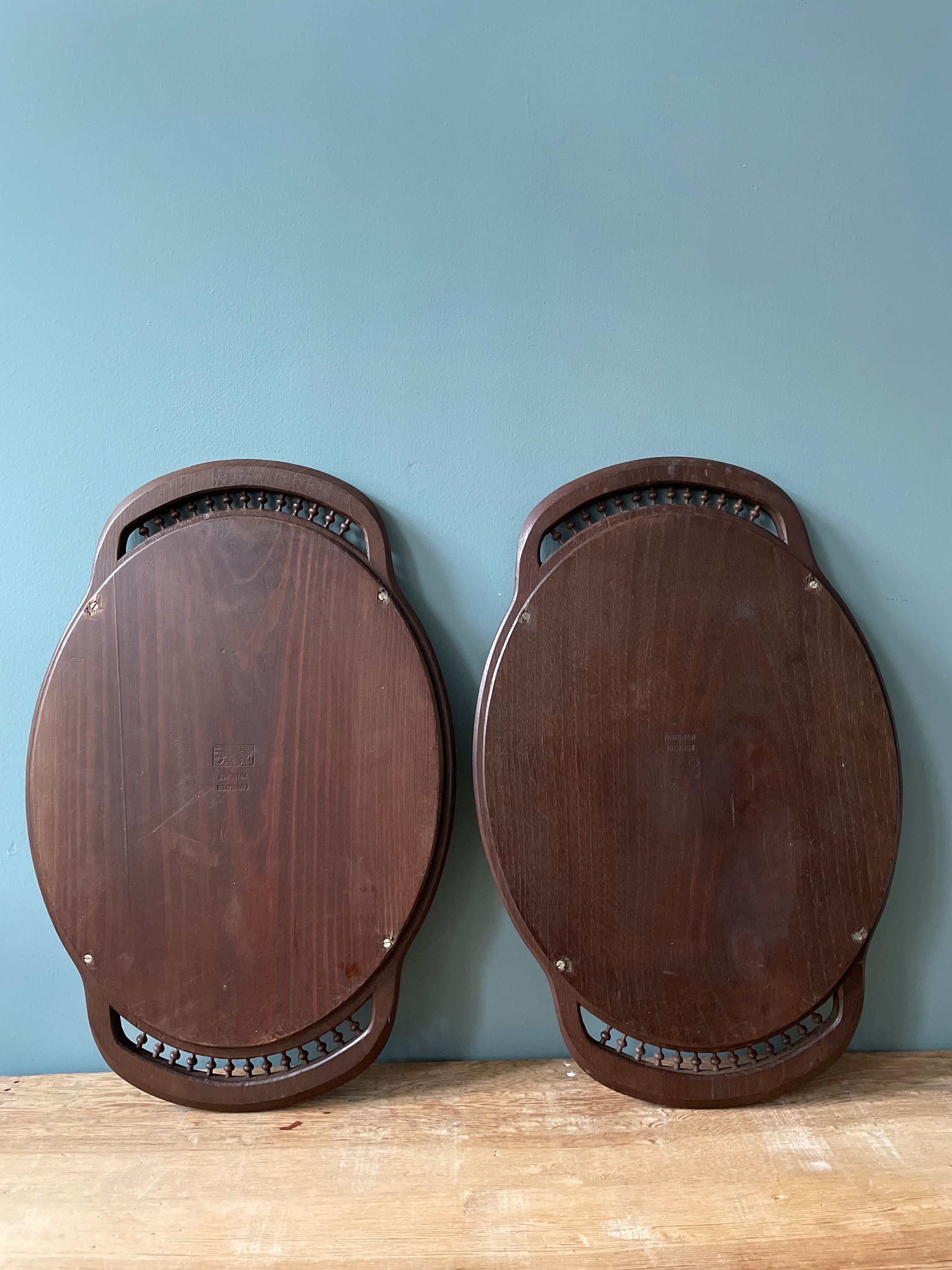 Set of two vintage carved oak service trays