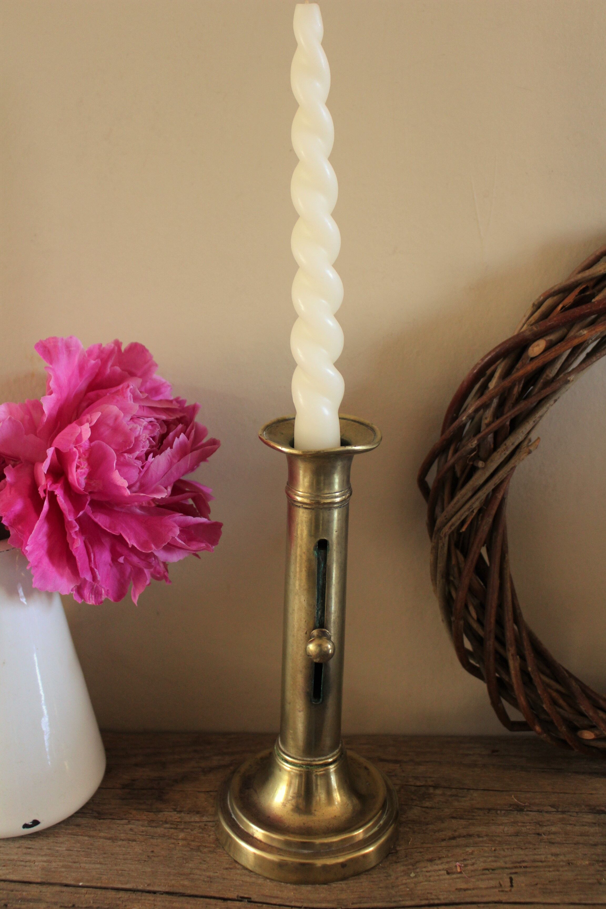 Push-button brass torch candle holder