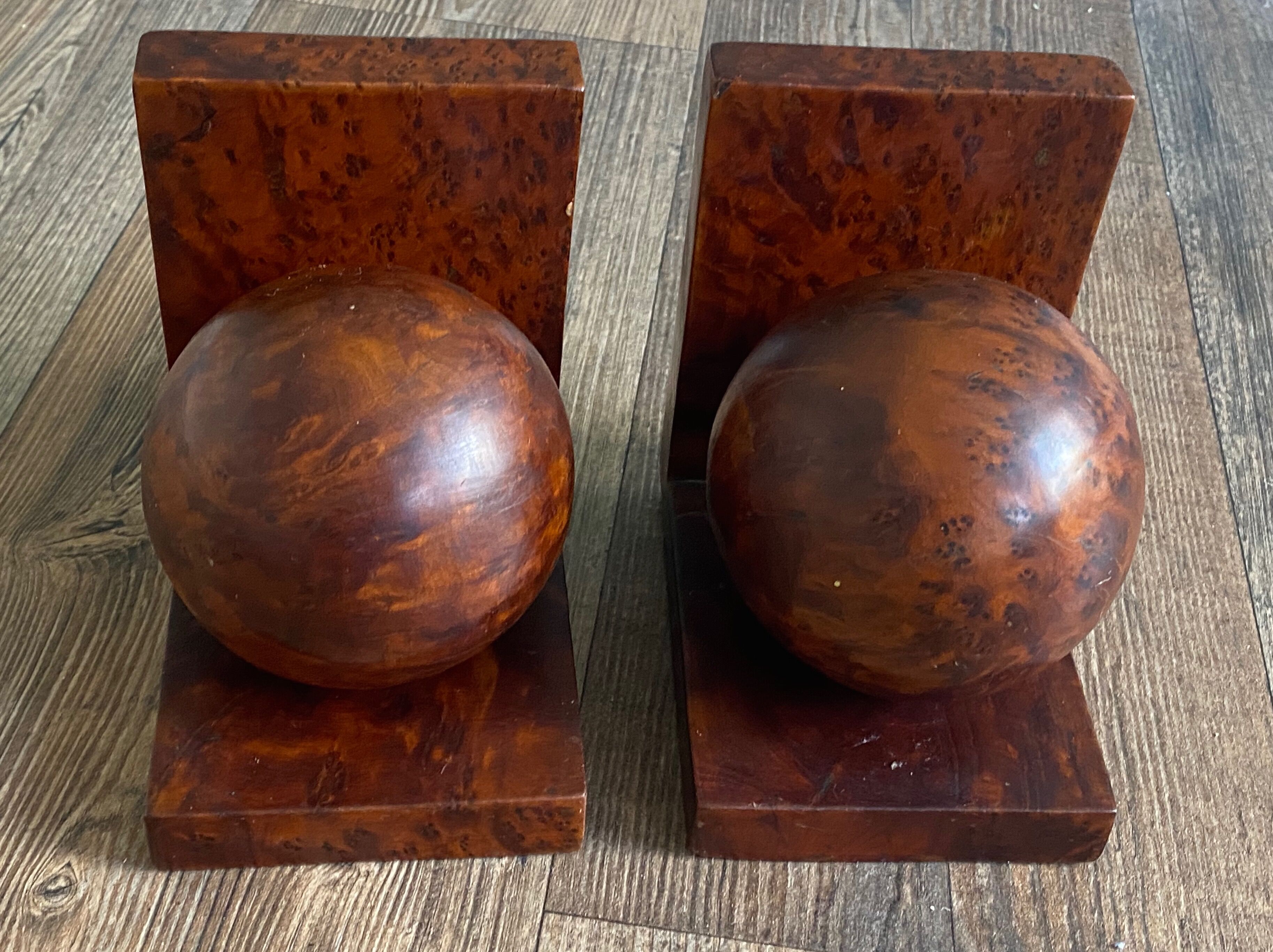Pair of bookends adorned with spheres