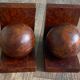 Pair of bookends adorned with spheres