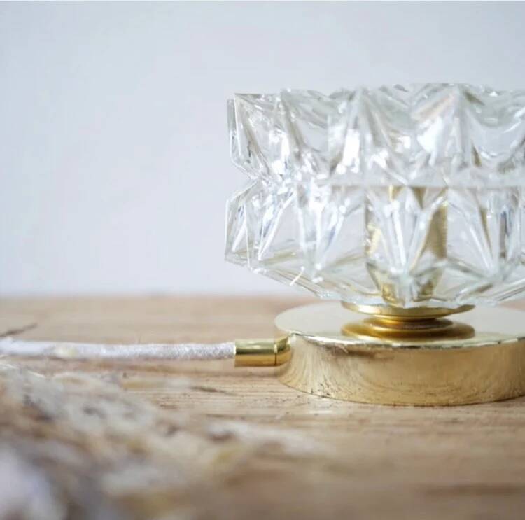 Table lamp with cut glass in the shape of a star.