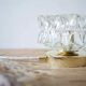 Table lamp with cut glass in the shape of a star.