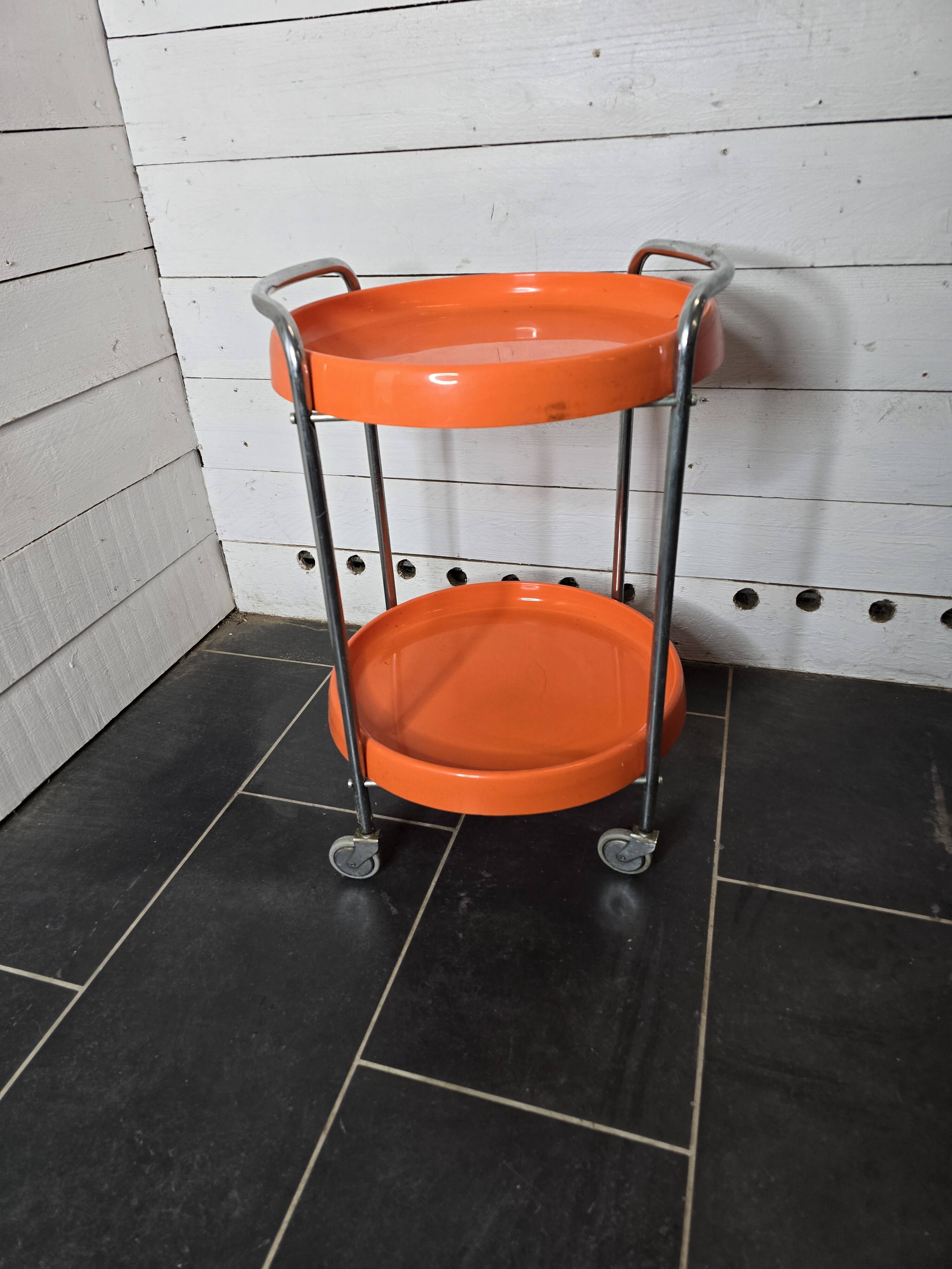 Orange trolley on wheels from the 70s