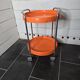 Orange trolley on wheels from the 70s
