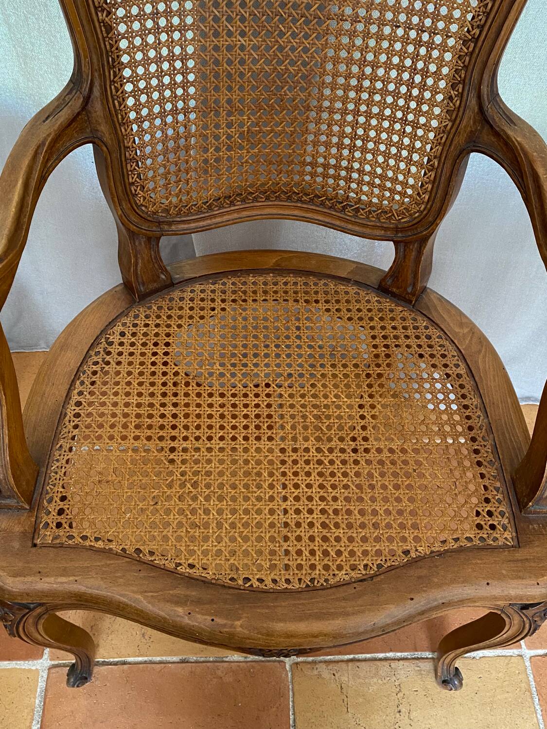 Louis XV style caned armchair